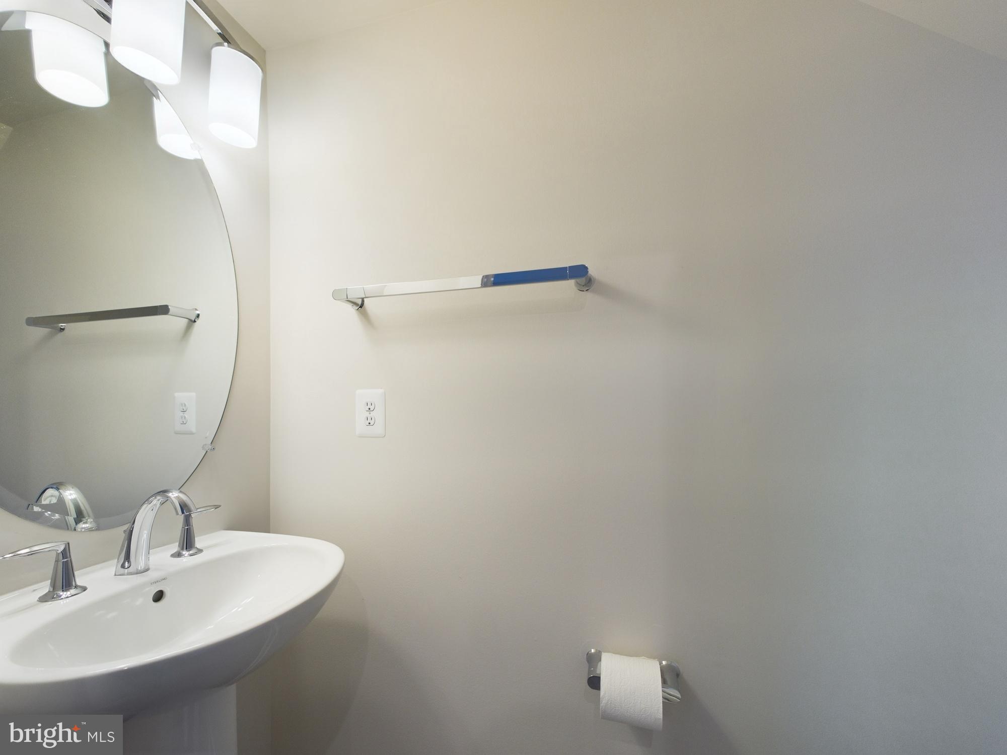 43801 Middleway Terrace Ashburn, VA 20147 - Photo 19 of 54 a bathroom with a sink and mirror