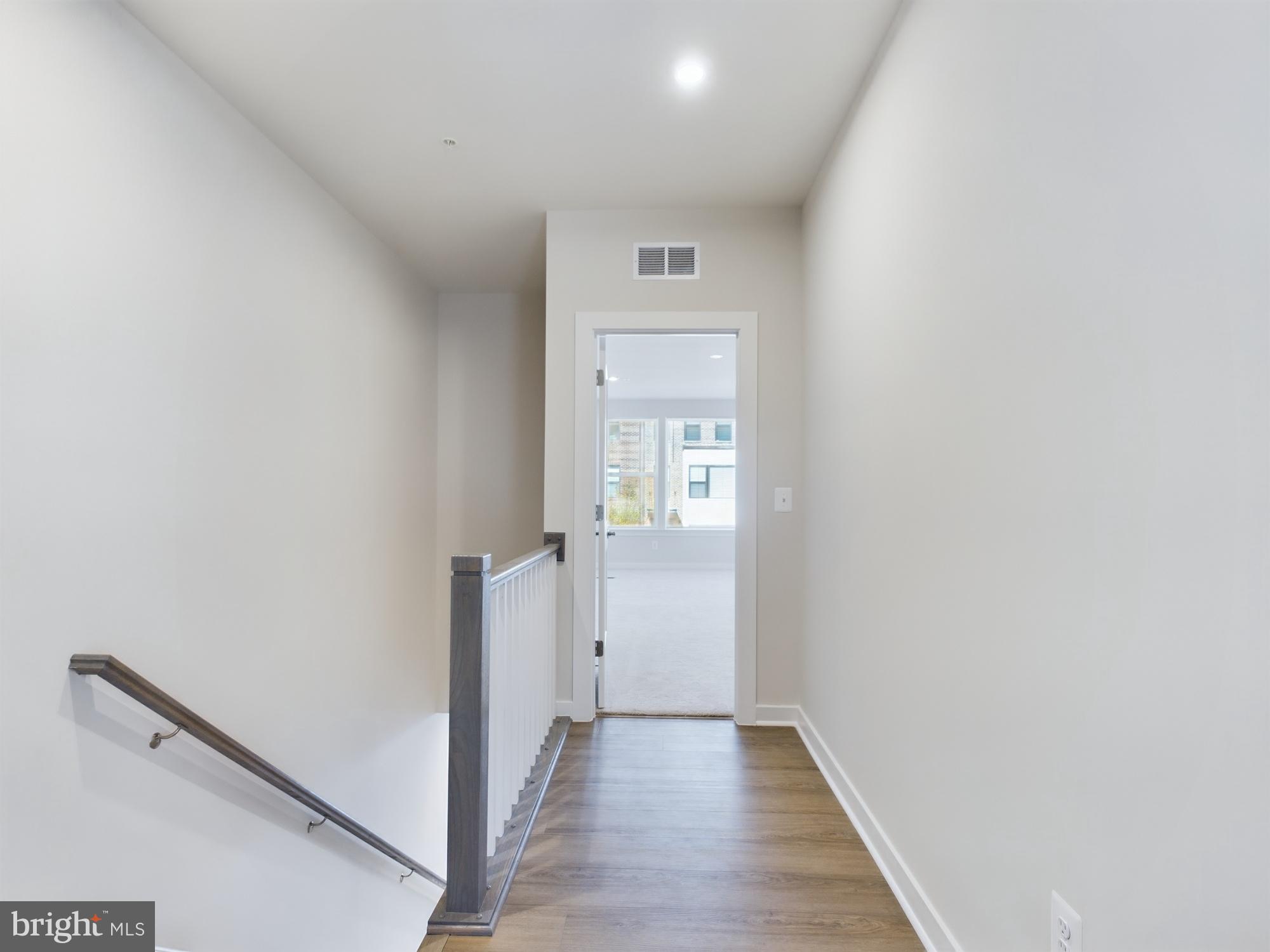 43801 Middleway Terrace Ashburn, VA 20147 - Photo 23 of 54 a view of a hallway with wooden floor
