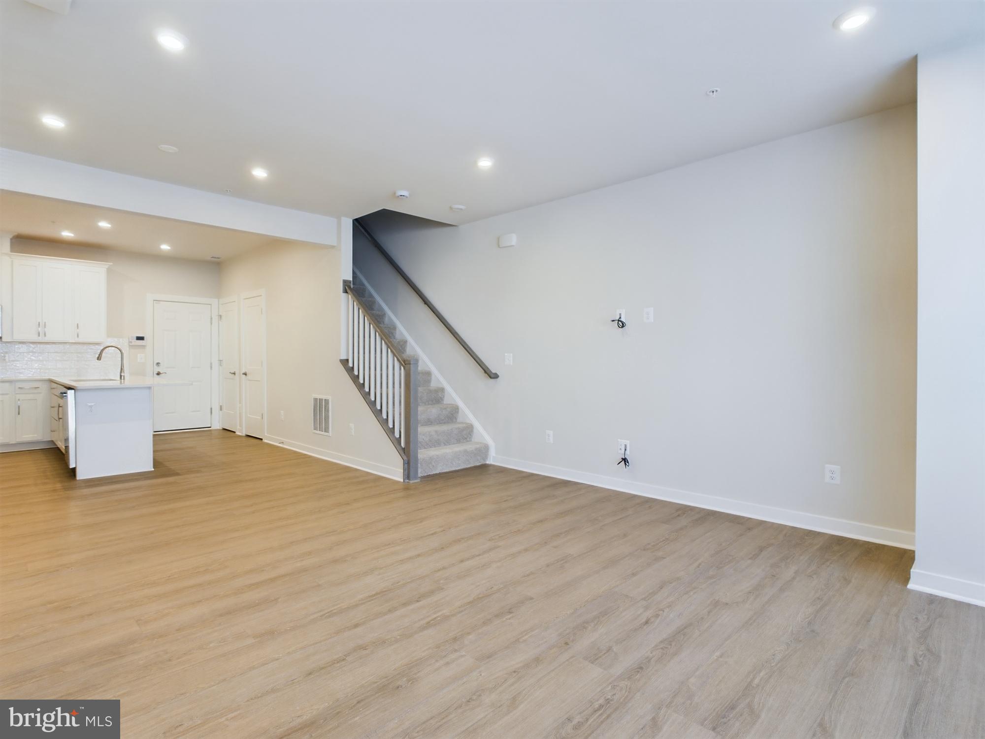 43801 Middleway Terrace Ashburn, VA 20147 - Photo 4 of 54 a view of an empty room with wooden floor