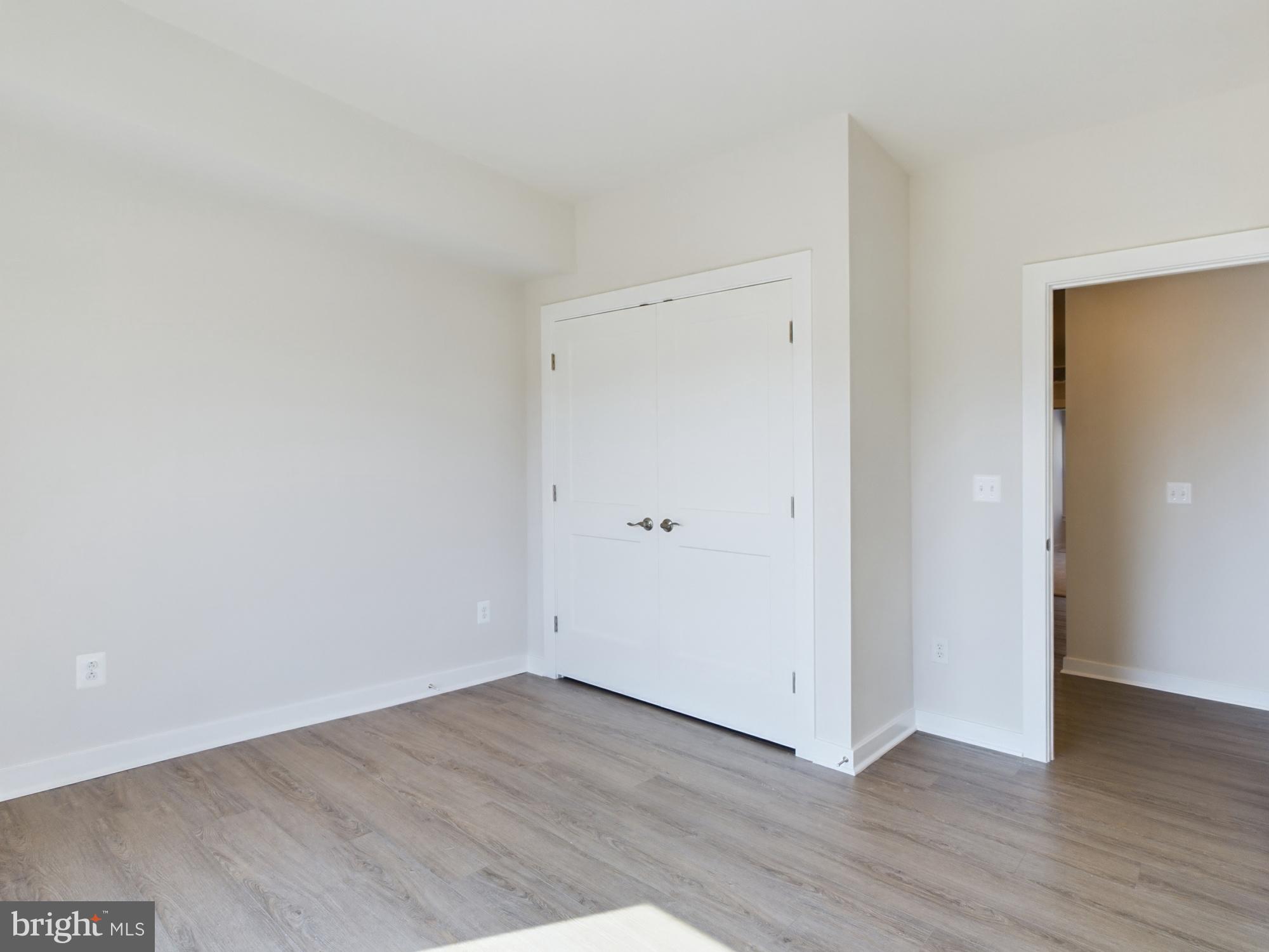43801 Middleway Terrace Ashburn, VA 20147 - Photo 46 of 54 a view of an empty room with wooden floor
