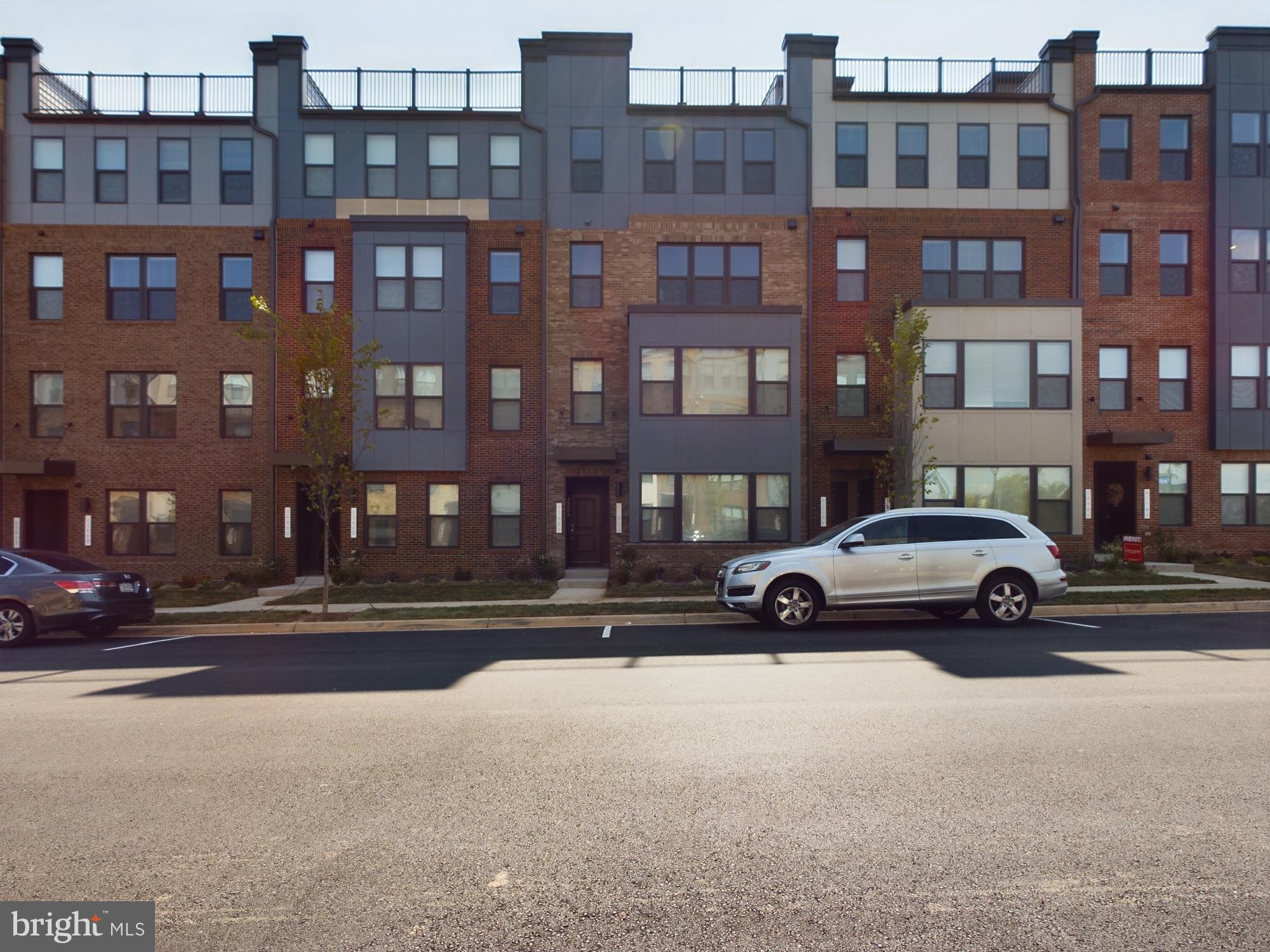 43801 Middleway Terrace Ashburn, VA 20147 - Photo 53 of 54 a view of building with car parked