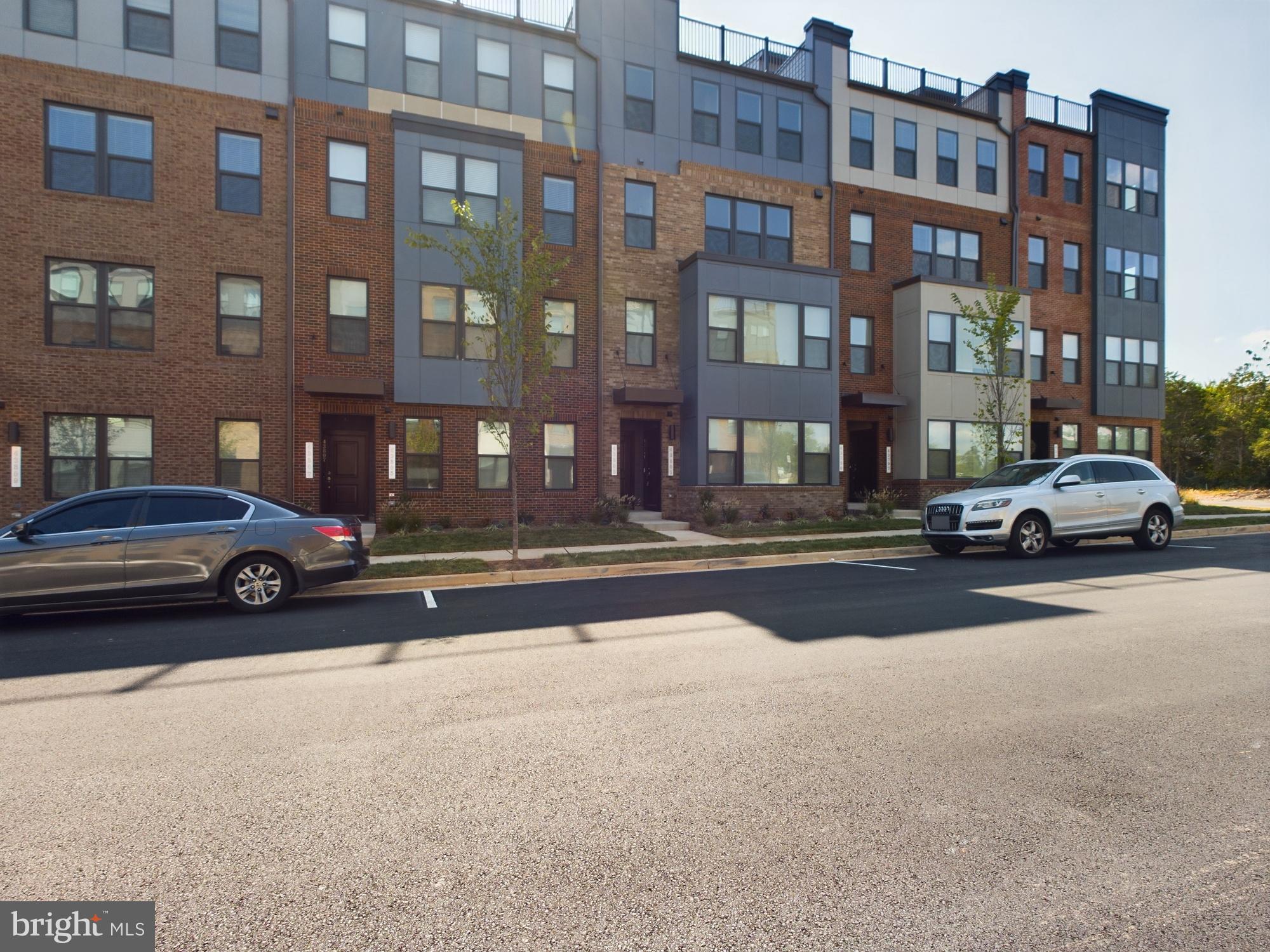43801 Middleway Terrace Ashburn, VA 20147 - Photo 54 of 54 a cars parked in front of a building