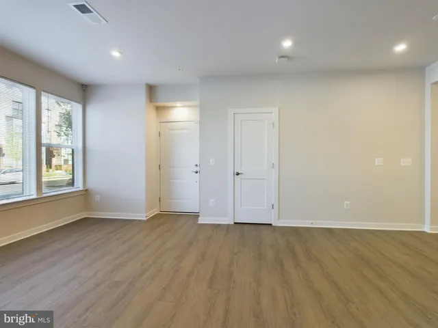 a kitchen with stainless steel appliances a refrigerator sink and microwave