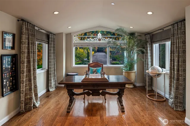 a dining room with furniture and wooden floor