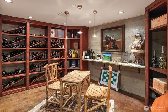 a living room with lots of furniture and a book shelf