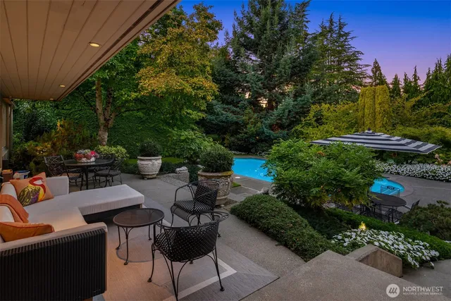 a view of a backyard with plants and a patio