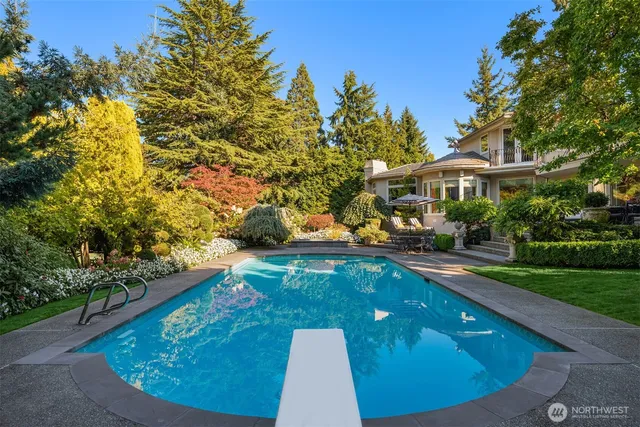 a view of a swimming pool with a patio