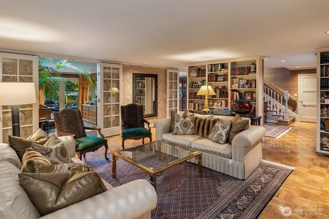 a living room with furniture and large window