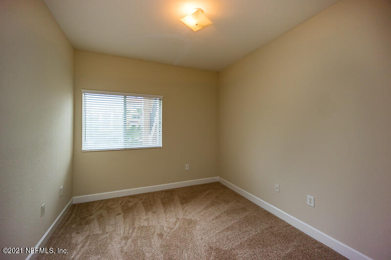 9745 Touchton Road, Unit 2602 Jacksonville, FL 32246 - Photo 53 of 63 a view of an empty room with a window