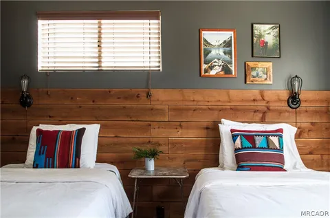 a lake view with boat and palm trees