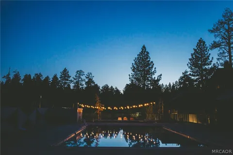 a view of a chairs and table in patio