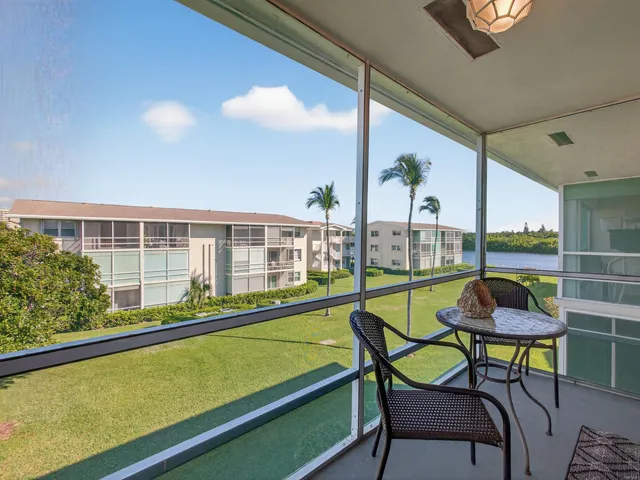 a view of swimming pool with seating area and furniture