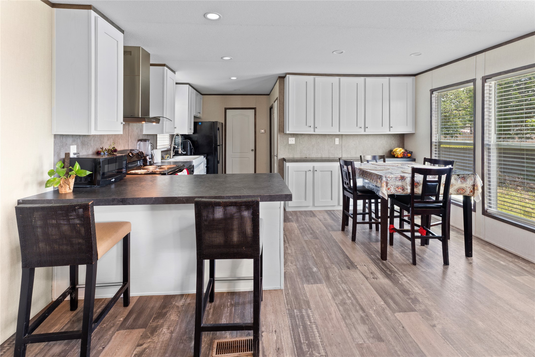 109 Hibiscus Cove Elgin, TX 78621 - Photo 4 of 15 Prepare meals in this modern kitchen featuring a functional island with casual bar seating.