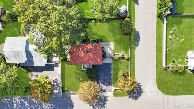 an aerial view of a house with a garden and swimming pool