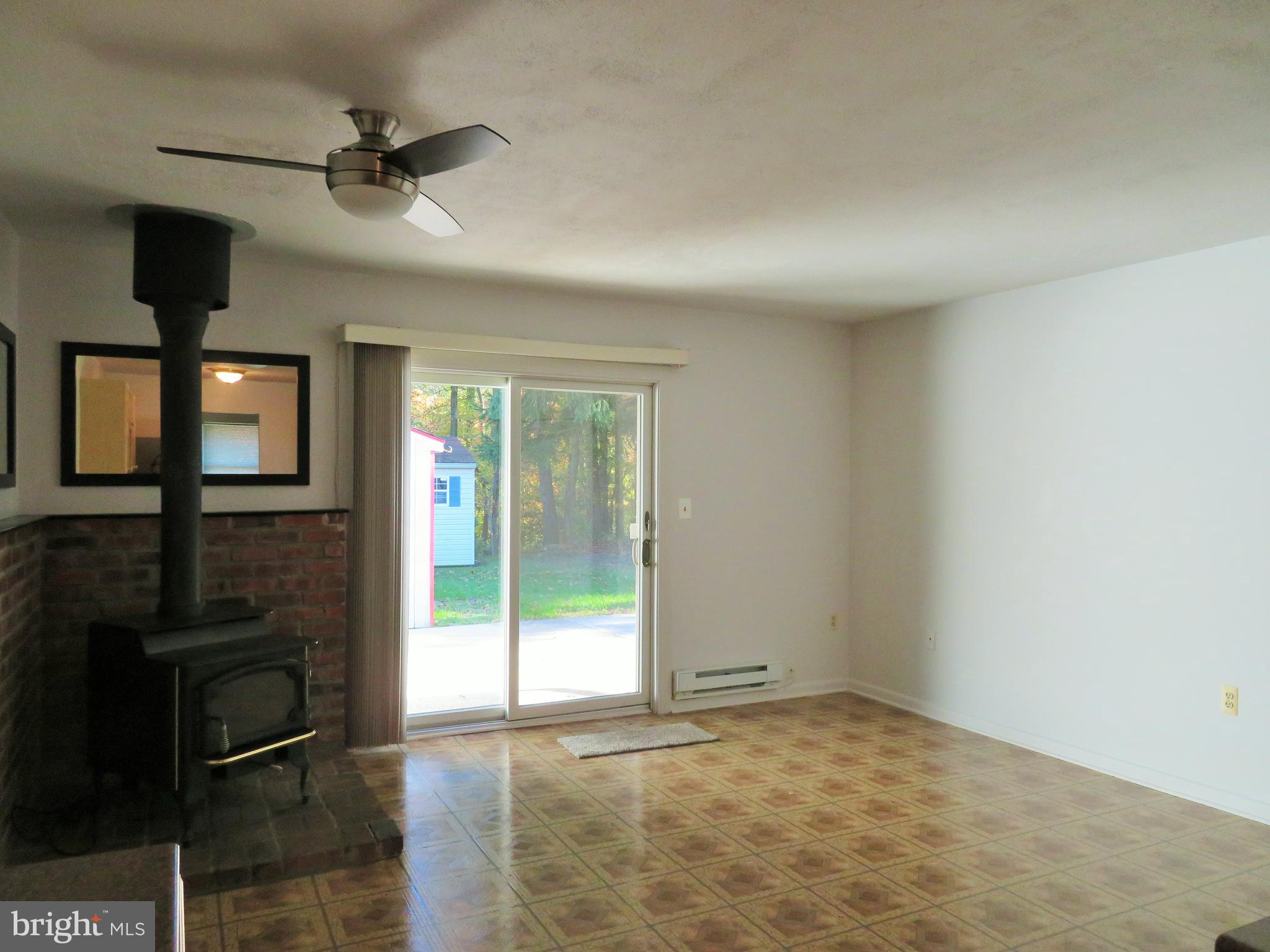 115 Haverhill Road Joppa, MD 21085 - Photo 17 of 35 Family Room with sliders to the patio & rear yard!