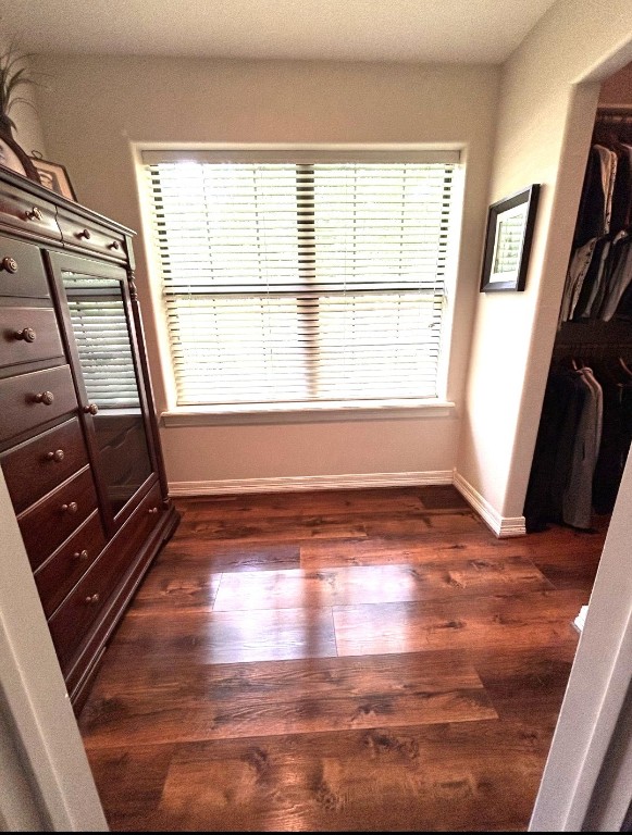 318 Ridgewood Road Goodrich, TX 77335 - Photo 16 of 49 a view of an empty room with wooden floor and a window