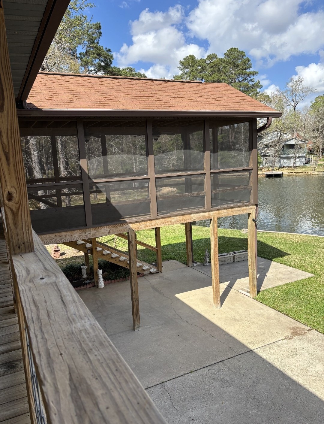318 Ridgewood Road Goodrich, TX 77335 - Photo 29 of 49 a view of a patio with table and chairs with wooden floor and fence
