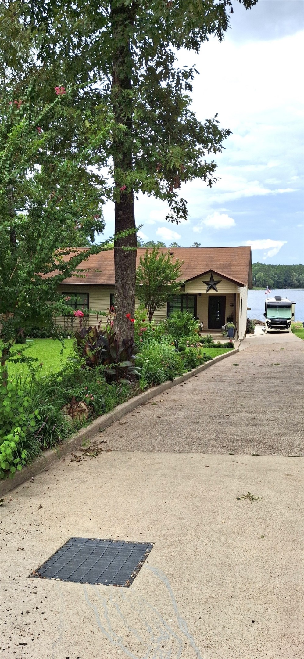 318 Ridgewood Road Goodrich, TX 77335 - Photo 44 of 49 a front view of a house with a yard and mountain view in back