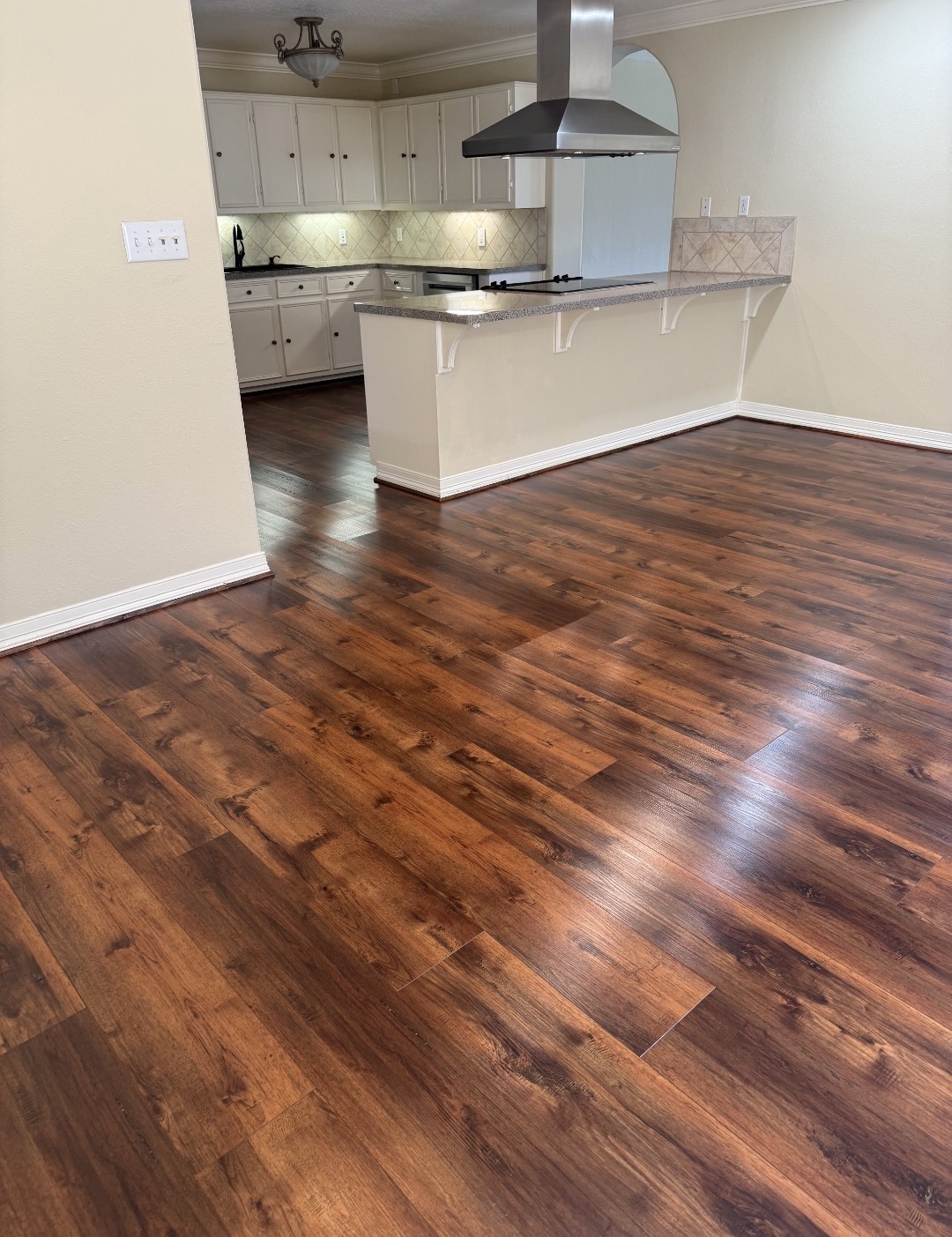 318 Ridgewood Road Goodrich, TX 77335 - Photo 5 of 49 a view of a kitchen with a sink and wooden floor