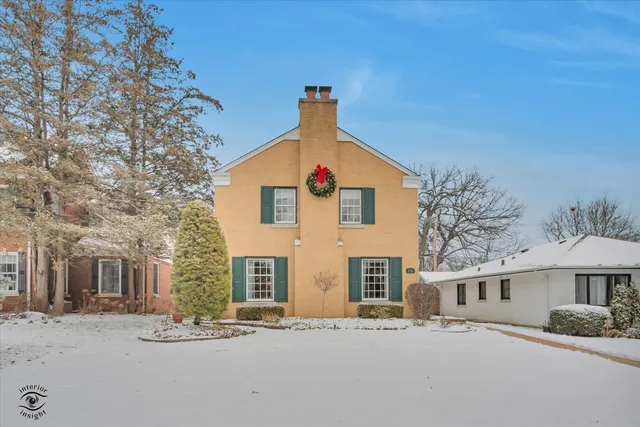 a view of white house with a yard