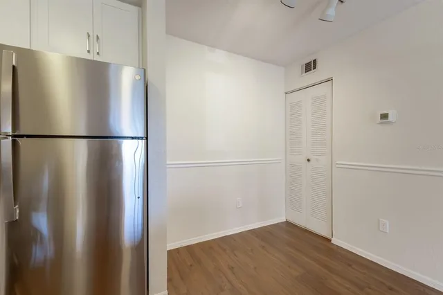 a white refrigerator freezer sitting in a kitchen