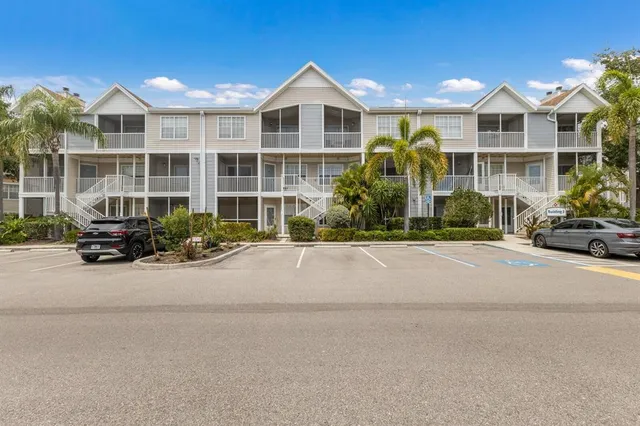 a front view of a building with a yard