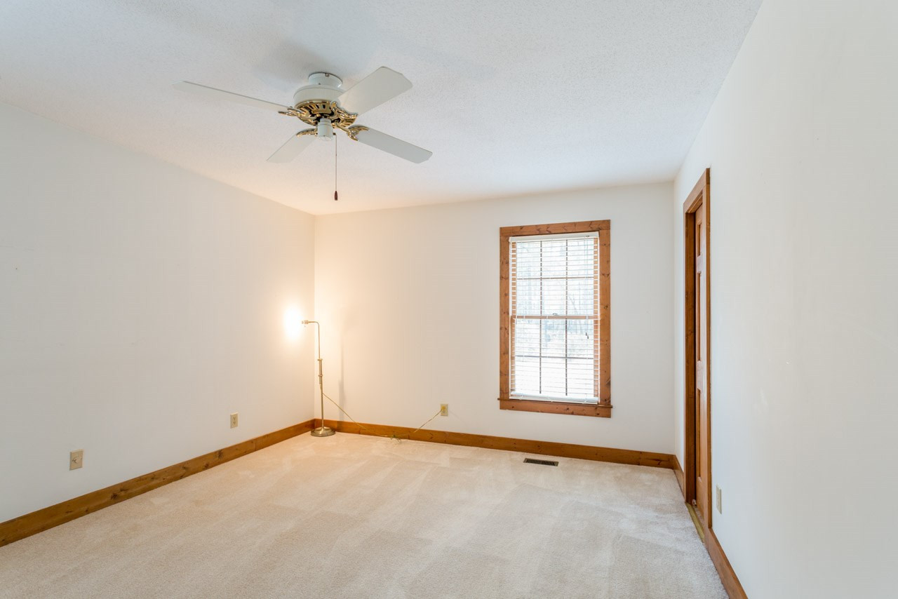 10405 Boxelder Drive Raleigh, NC 27613 - Photo 11 of 25 Has a walk in closet, the door on the right of the picture is the full bath First Floor Bedroom