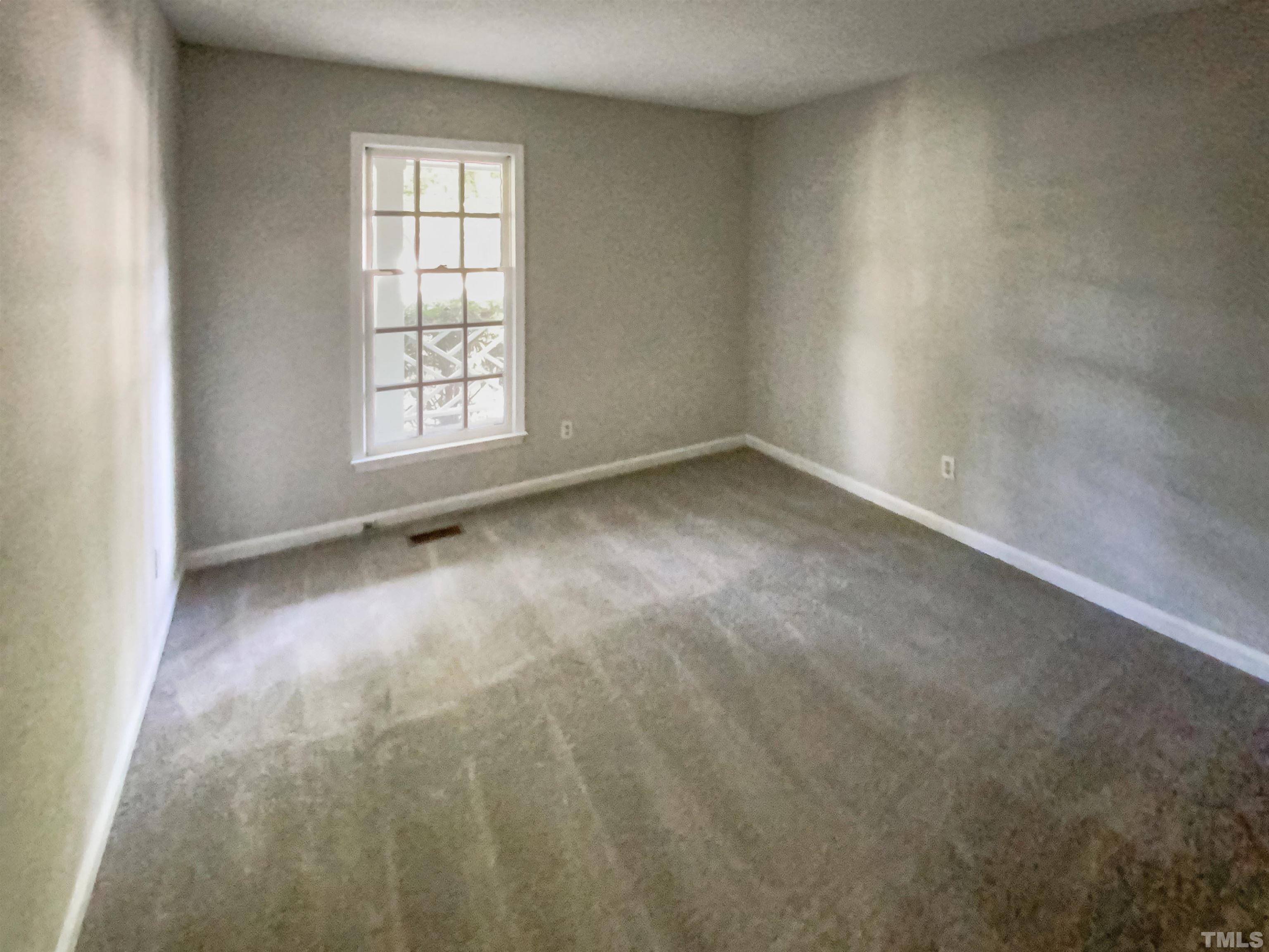 11817 North Exeter Way Raleigh, NC 27613 - Photo 17 of 17 an empty room with a window