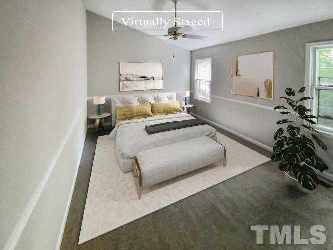 11817 North Exeter Way Raleigh, NC 27613 - Photo 3 of 17 a bedroom with furniture and a chandelier