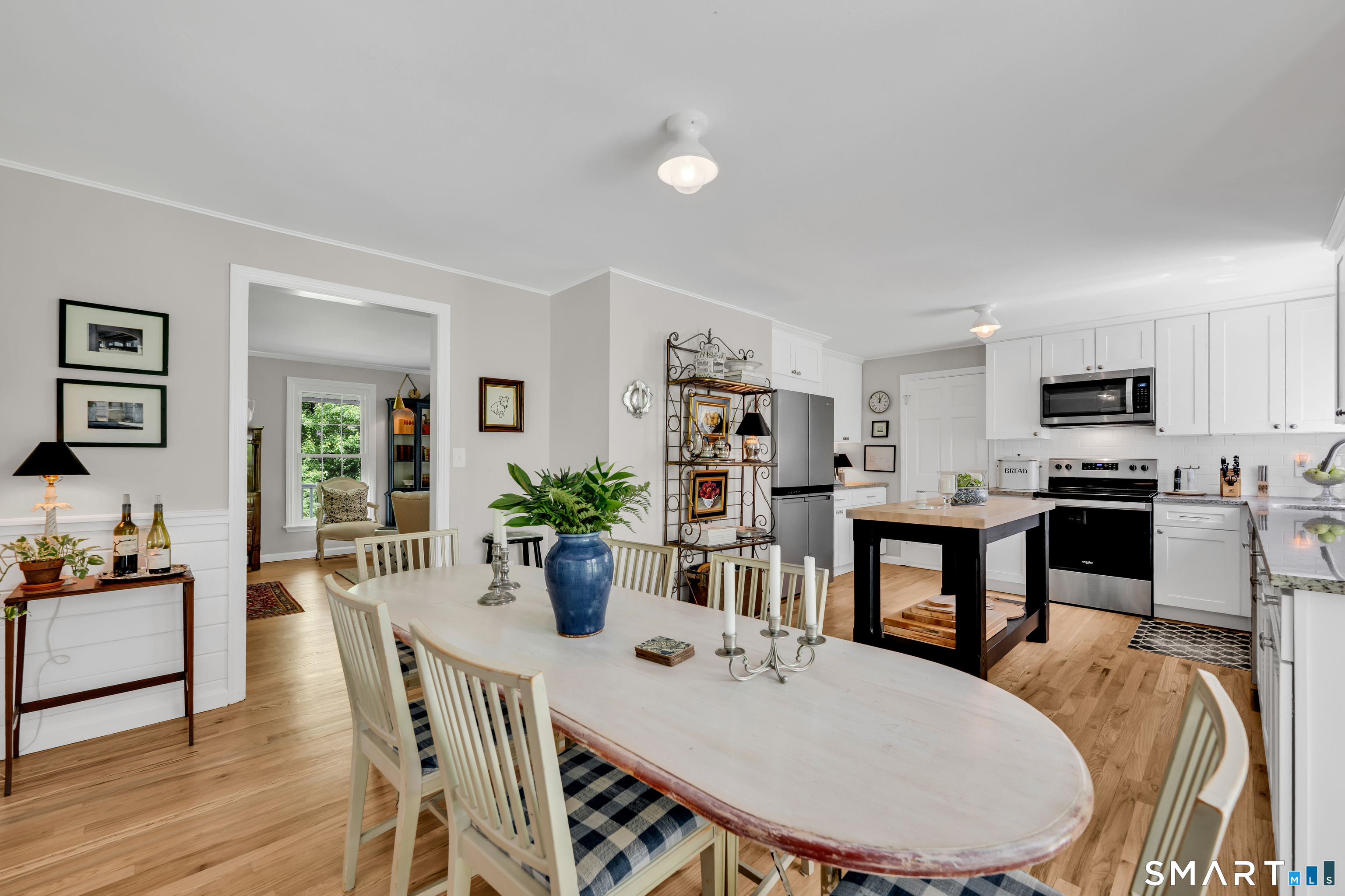 1000 Bassett Road Watertown, CT 06795 - Photo 9 of 35 a view of a dining room with furniture and wooden floor
