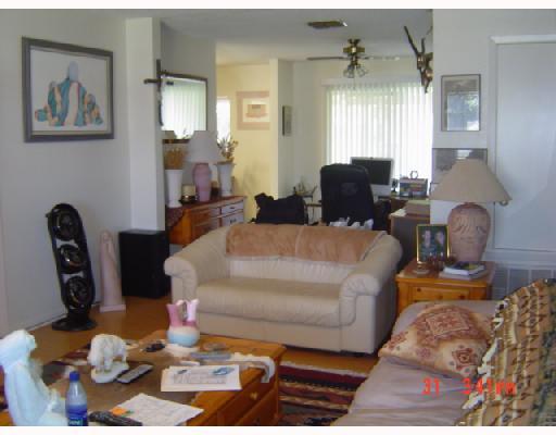 2821 Ransom Island Drive Corpus Christi, TX 78418 - Photo 5 of 6 a living room with furniture flowerpot and wooden floor