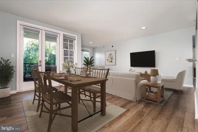 a view of a dining room with furniture window and wooden floor