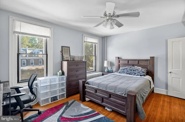 a bathroom with a sink toilet vanity and tub