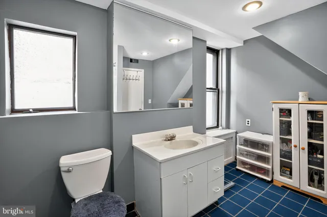 a bathroom with a tub and shower