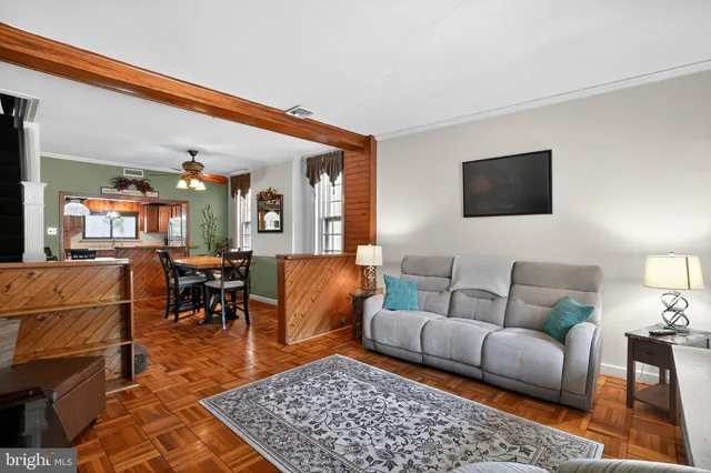 a living room with furniture and a rug