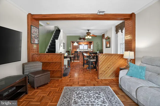 a living room with furniture and a rug