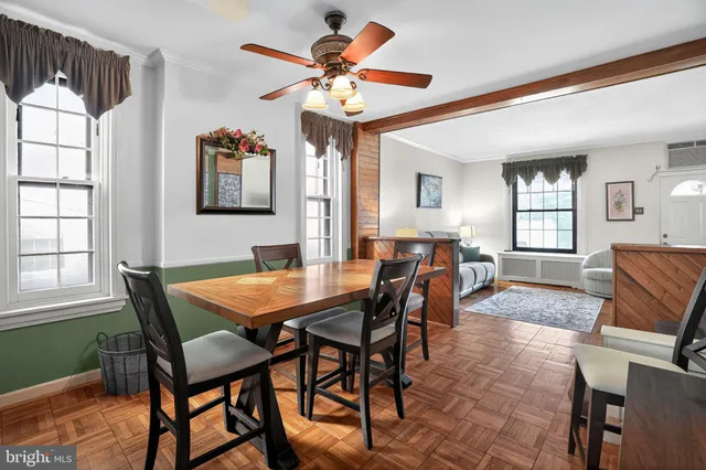 a dining room with furniture and window