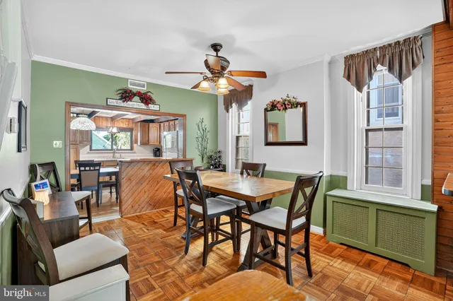 a dining room with furniture and window