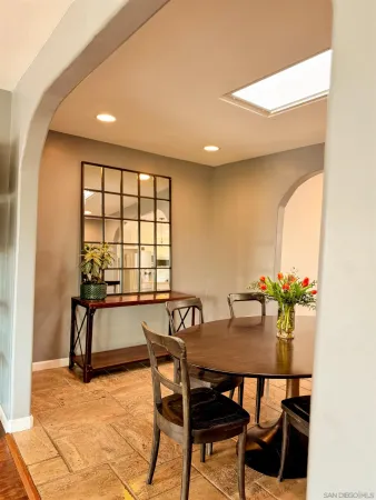 a kitchen with a stove and a white cabinet