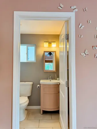 a bathroom with a toilet a sink and a shower
