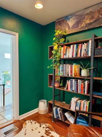 a room with furniture and a book shelf