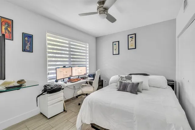 a bedroom with two beds and a couch