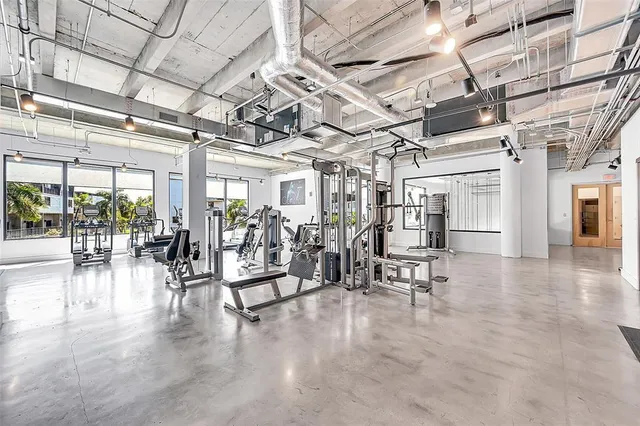a view of a room with lots of wooden furniture