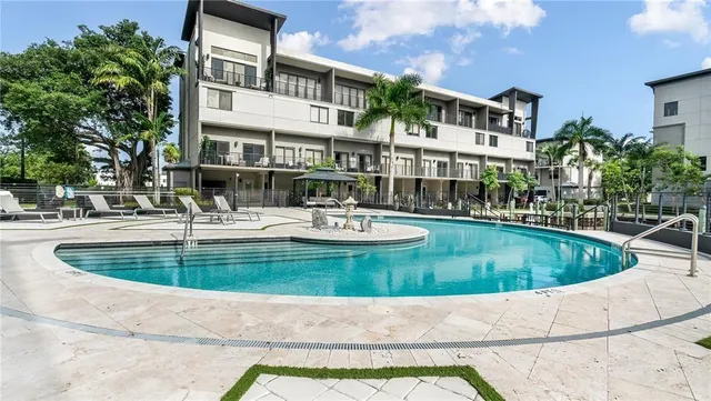a view of a house with swimming pool