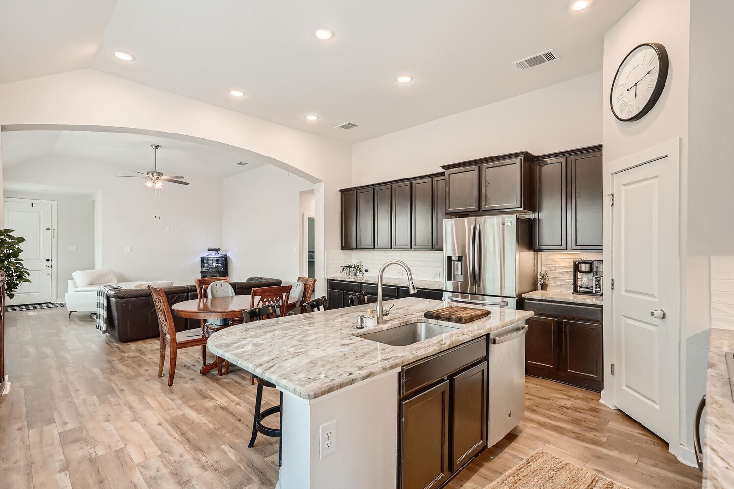 231 Spinnaker Loop Kyle, TX 78640 - Photo 9 of 24 a kitchen with stainless steel appliances granite countertop a sink and a refrigerator