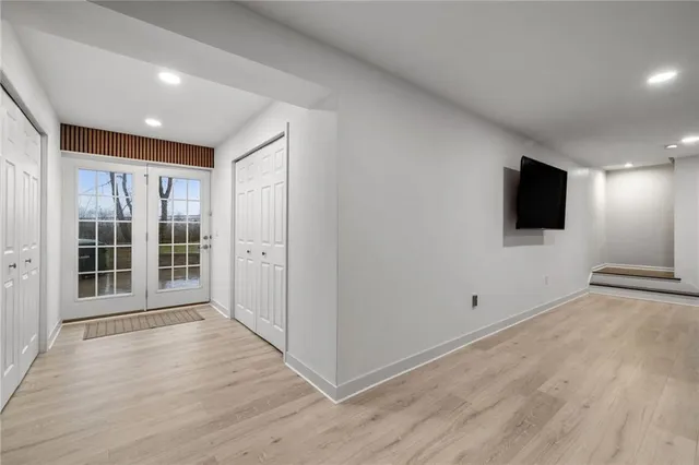 a view of a livingroom with an empty space and a window