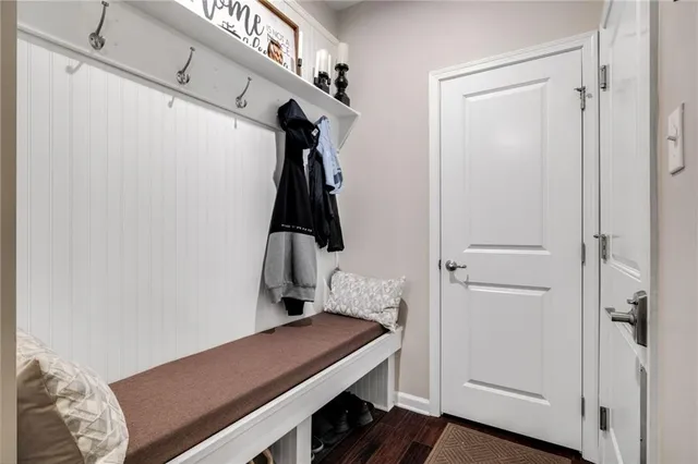 a room that has a bed and a table in it