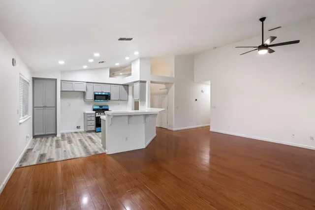 a kitchen with a sink a stove a refrigerator and a stove