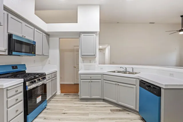 a view of a kitchen with kitchen and a sink