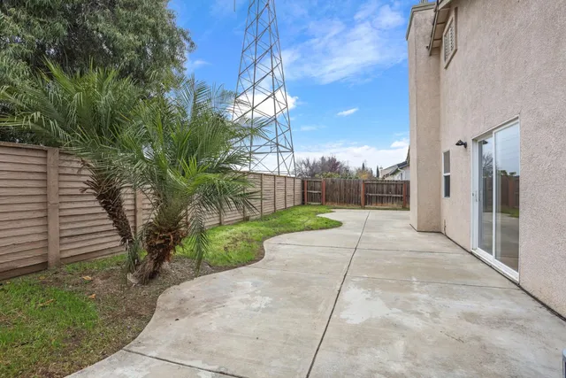 a living room with furniture a fireplace and a window